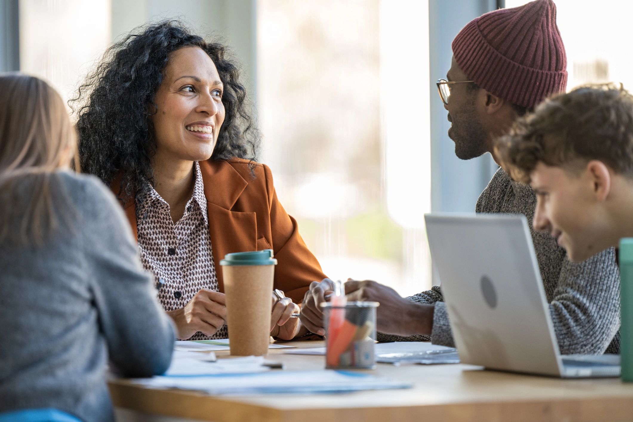 Founder-led team collaborating around an office table